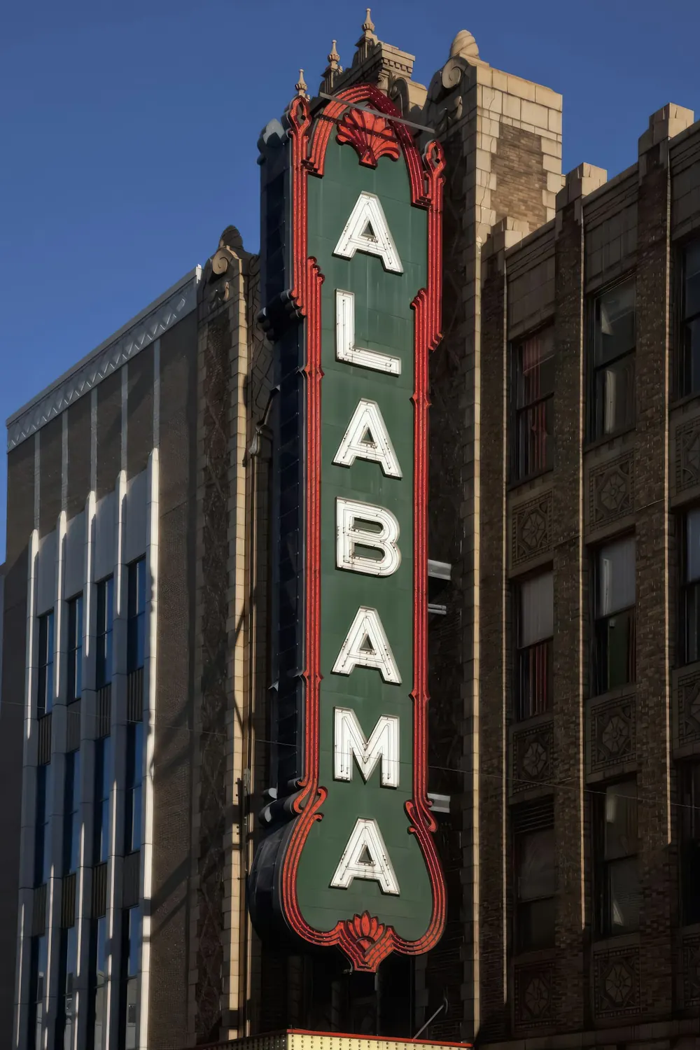 The vertical red and gold Alabama Theatre sign in downtown Birmingham